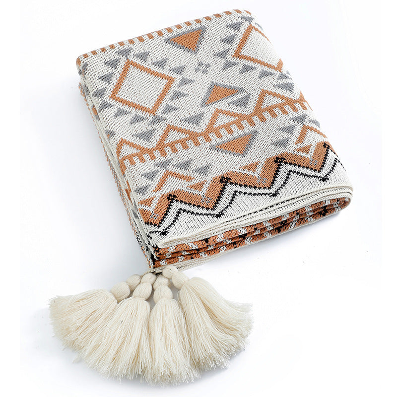 Geometrische Boho Strickdecke mit Fransen